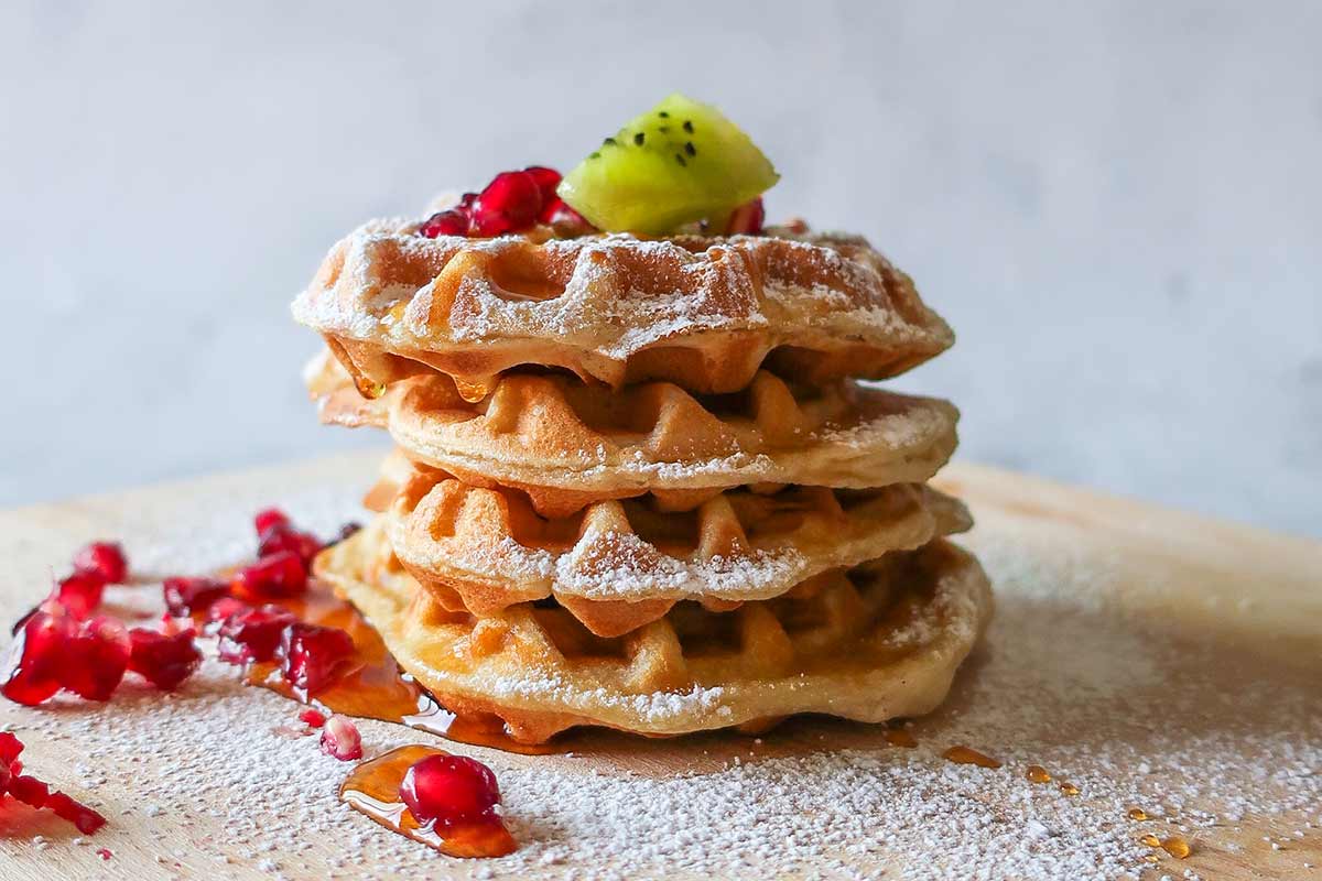 gluten-free-mothers-day-brunch-ideas , 4 waffles stacked and topped with kiwi and dusting of sugar