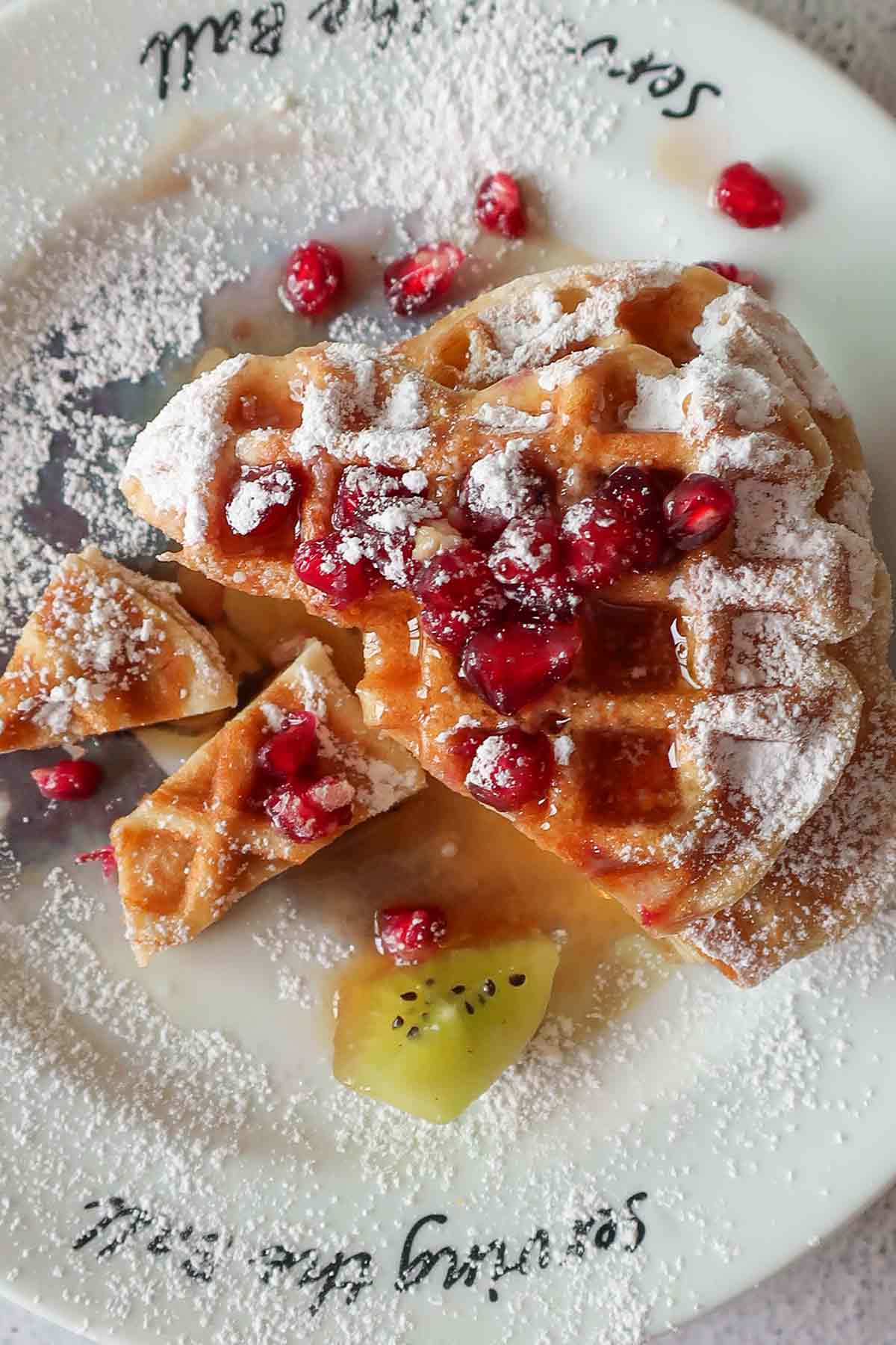 sliced waffles on a plate with toppings
