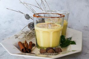 glass of eggnog, rimmed with cinnamon and sugar