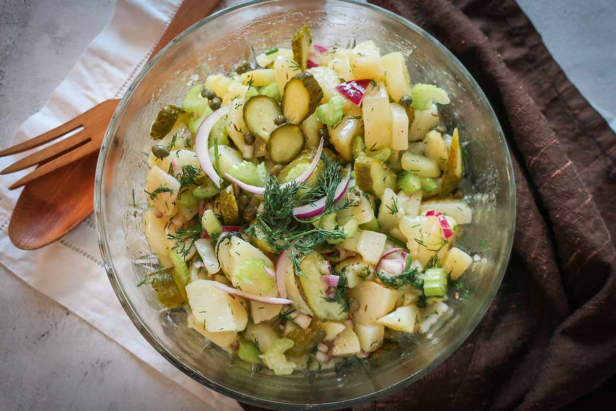 POTATO SALAD IN A LIGHT vinaigrette WITH HERBS IN A BOWL