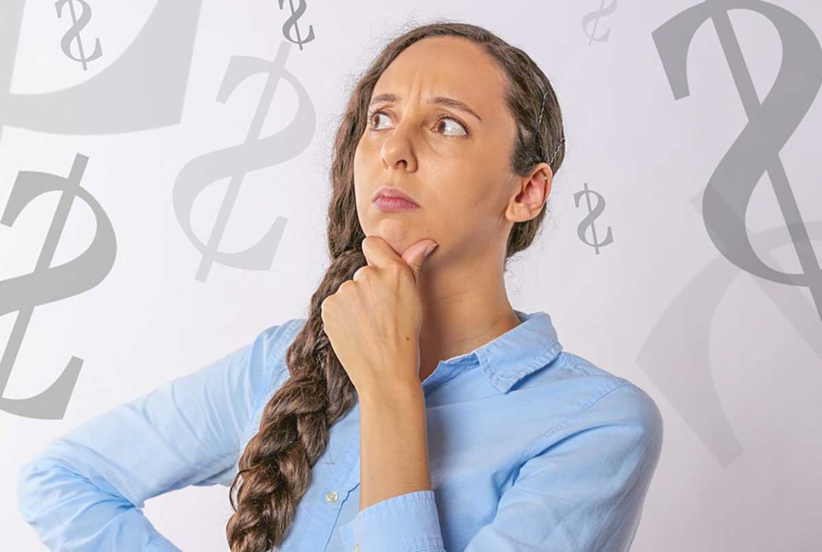 woman thinking about a budget, dollar signs in the background