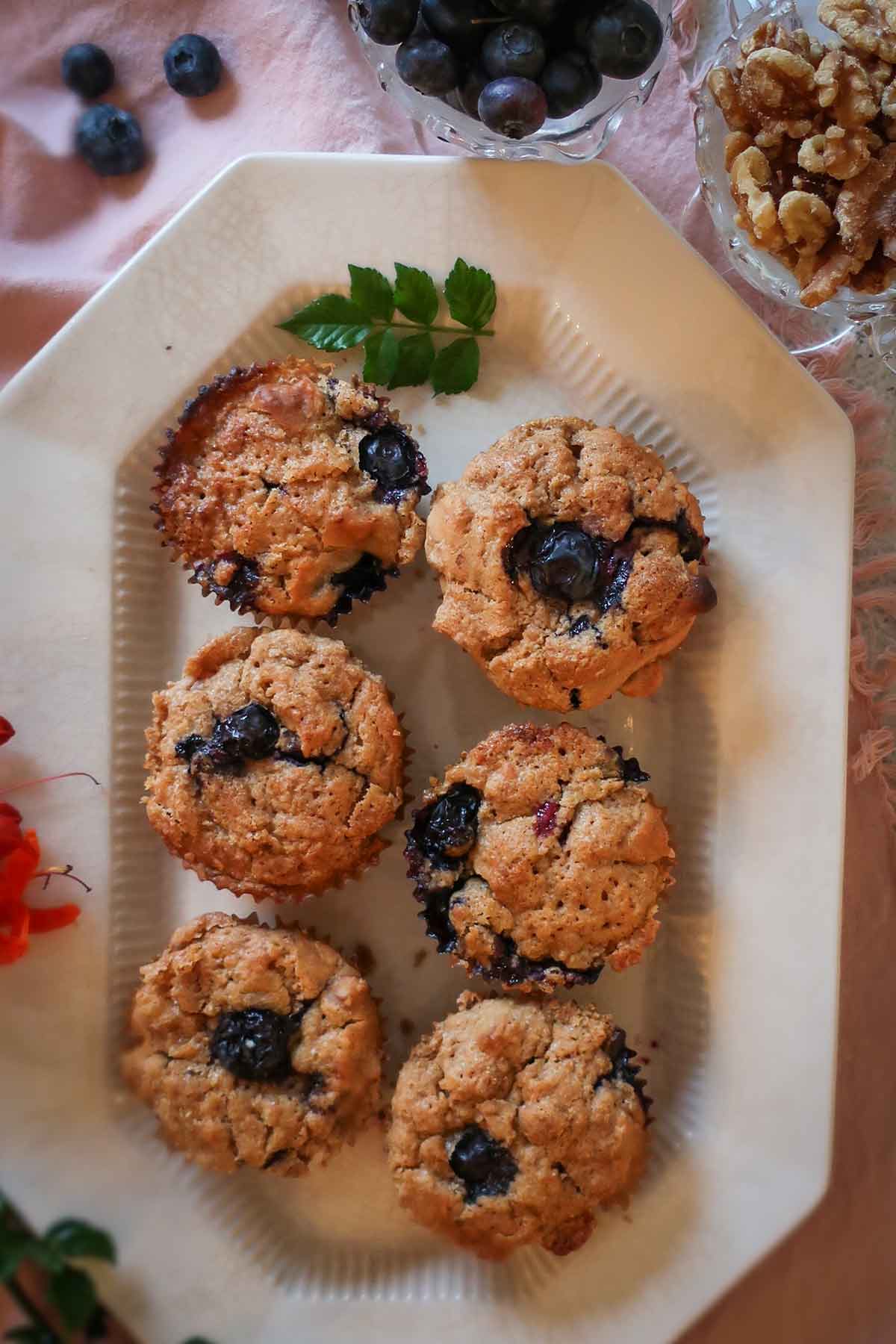 6 blueberry walnut muffins on a platter