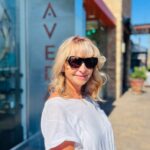 Kristina with sunglasses on a sunny summer day