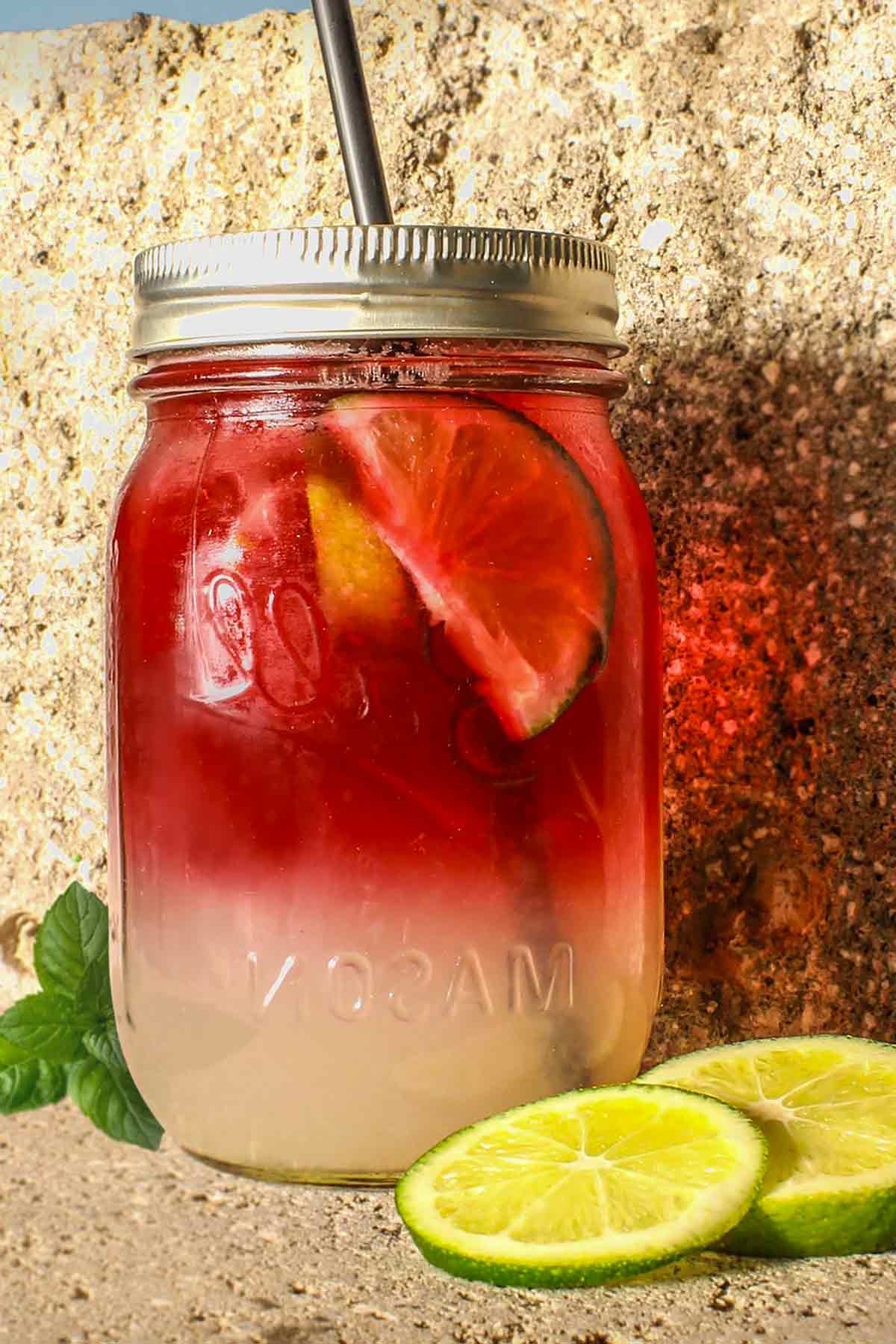 white sangria with lime slices in a mason jar
