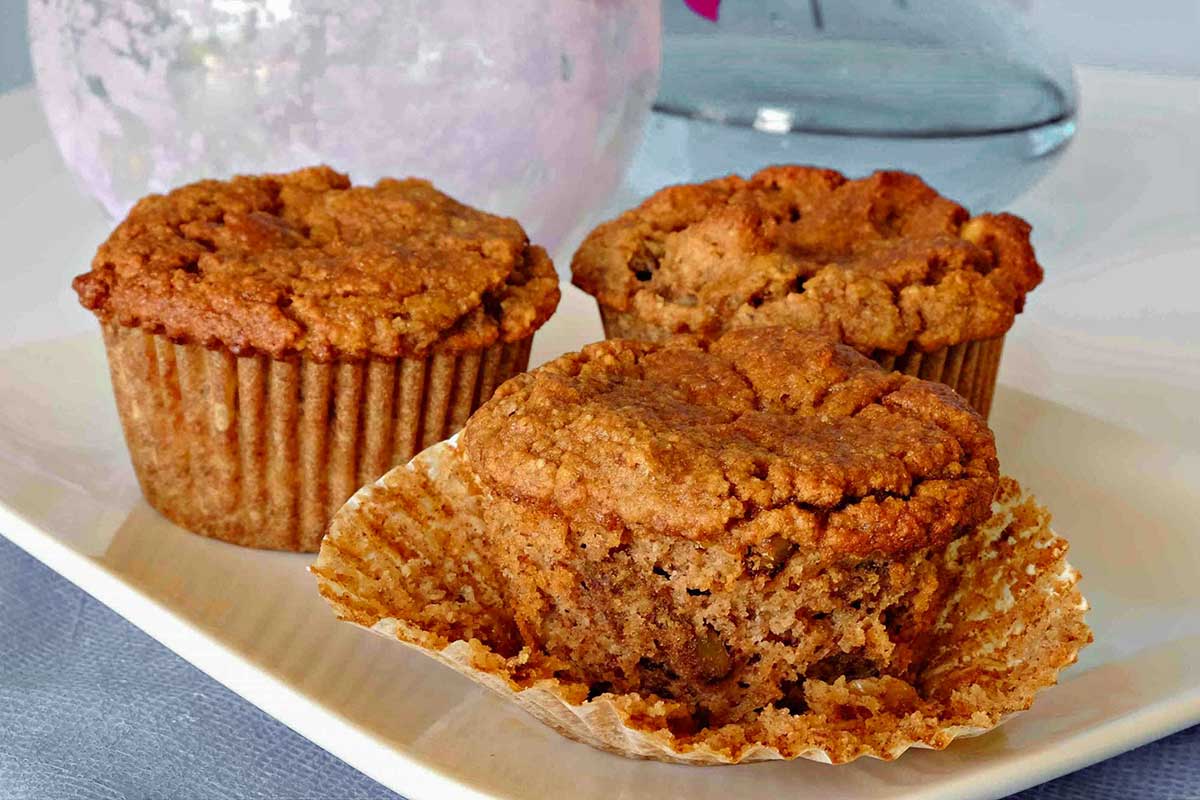 close up of banana apple muffin showing tender texture on the inside