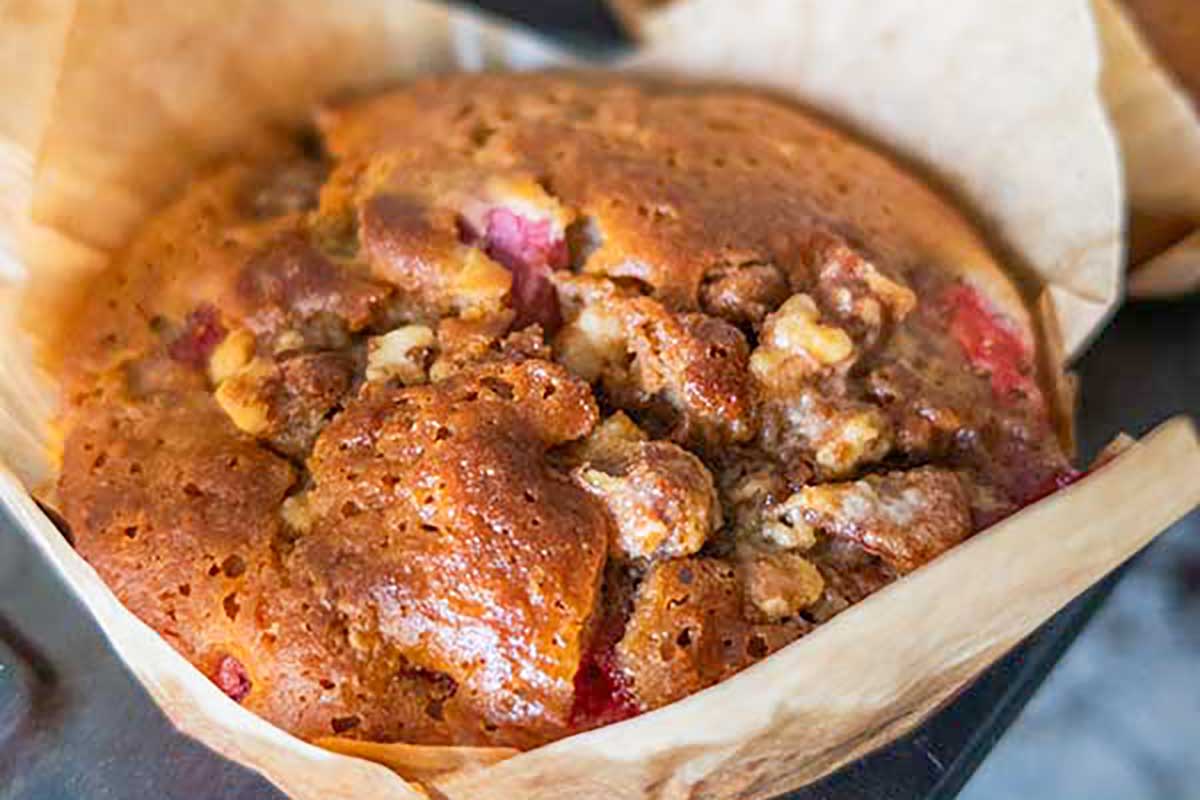 close up of gluten & dairy free strawberry pecan muffin