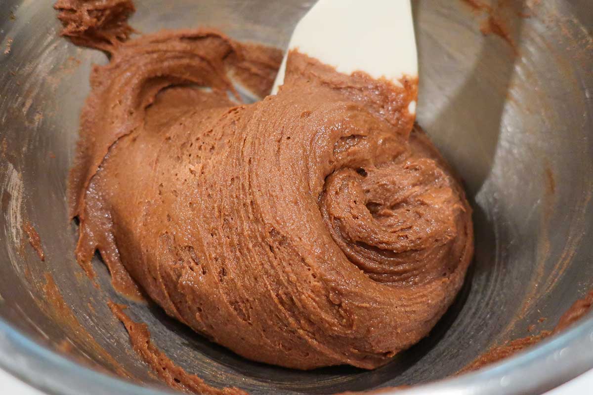 crinkle cookie dough in a bowl with a spatula showing the creamy texture