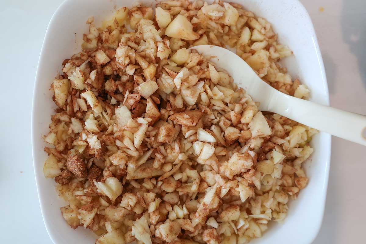 chopped apples with brown sugar and cinnamon in a bowl and set aside.