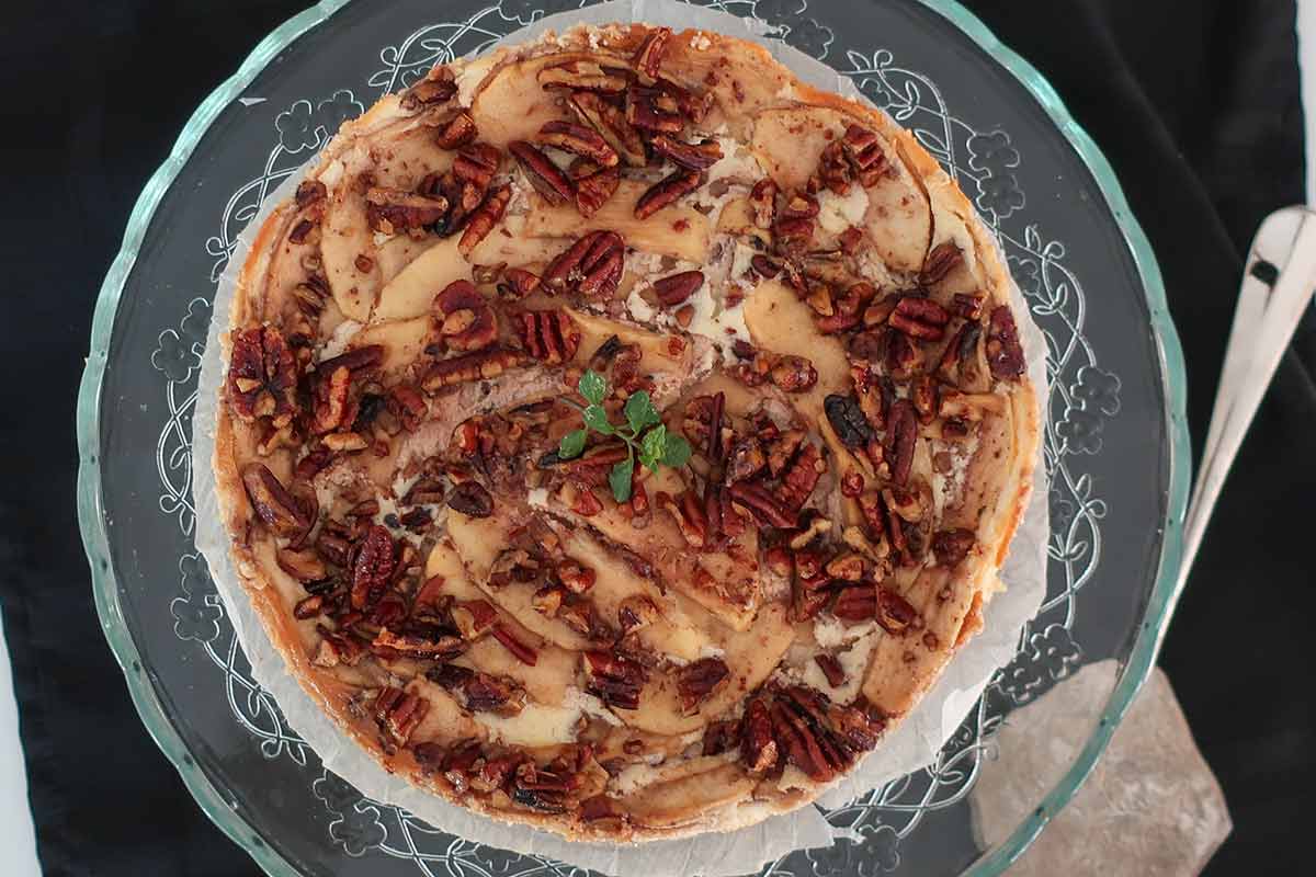 top view of baked Danish apple ricotta cake on a platter