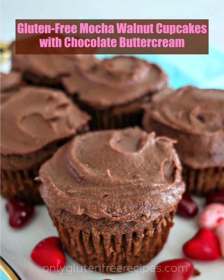 Mocha walnut cupcakes topped with chocolate buttercream on a plate with red hearts
