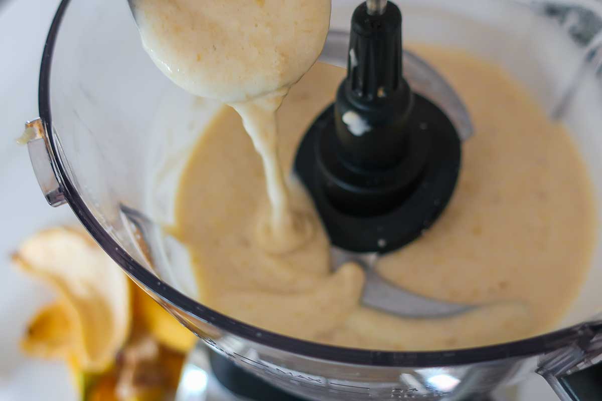 Ripe bananas blended until smooth and creamy in a food processor bowl.