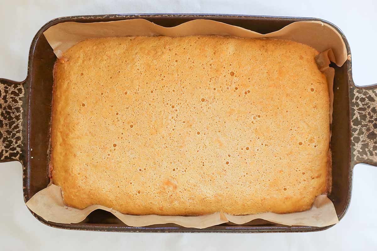 baked maple lemon bars in a baking pan allowing them to set