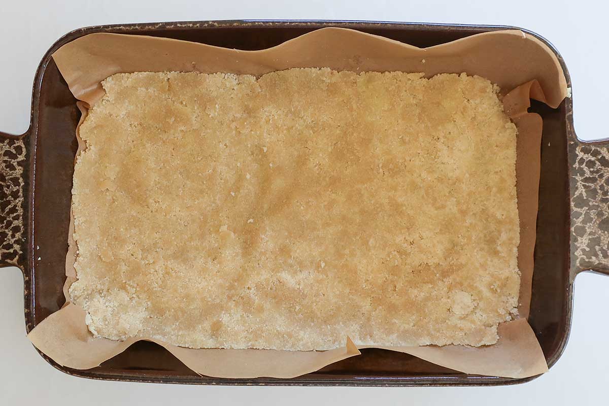 The dough firmly pressed evenly into the bottom of prepared pan