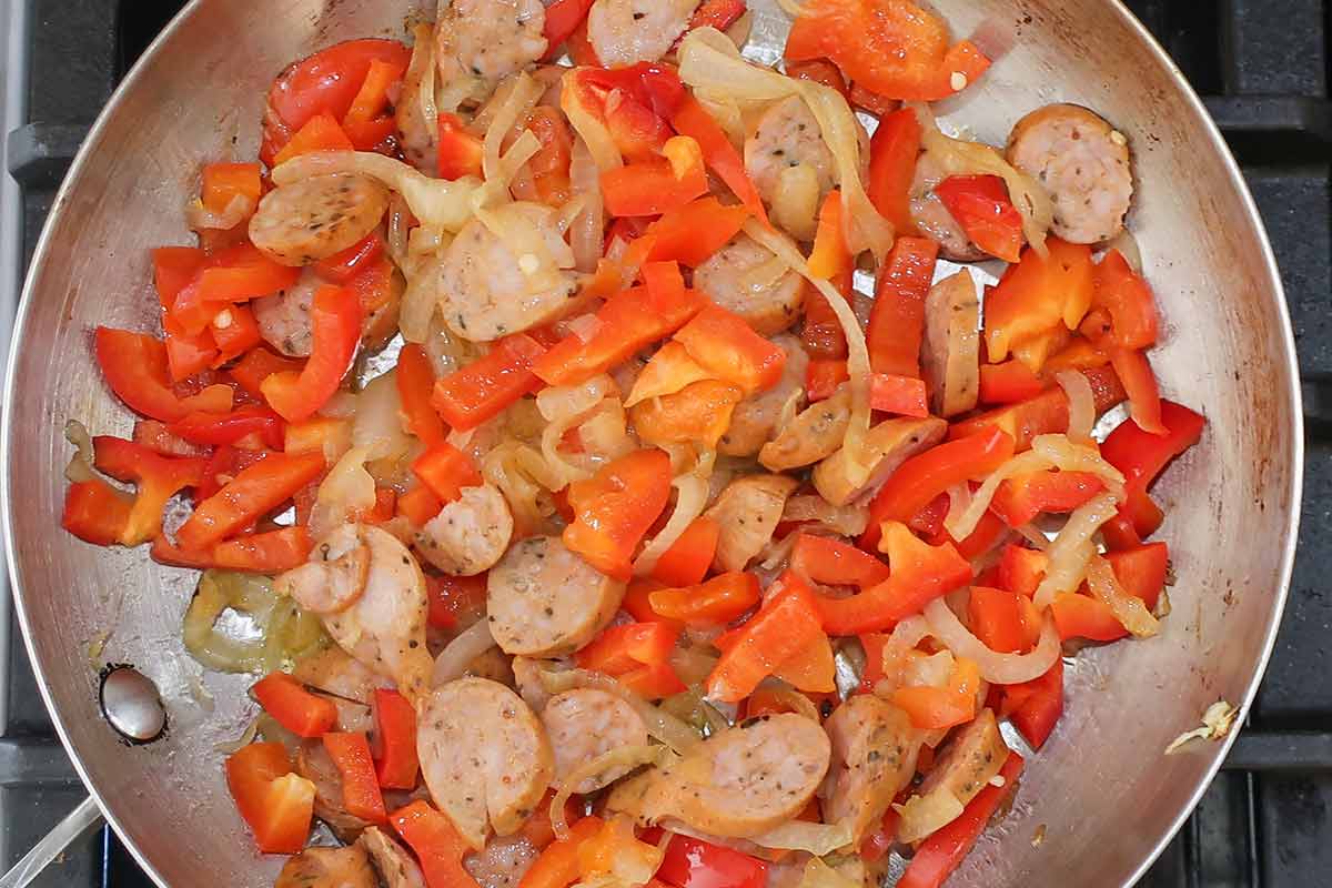 sautéing onions, red peppers and thyme with olive oil in a skillet
