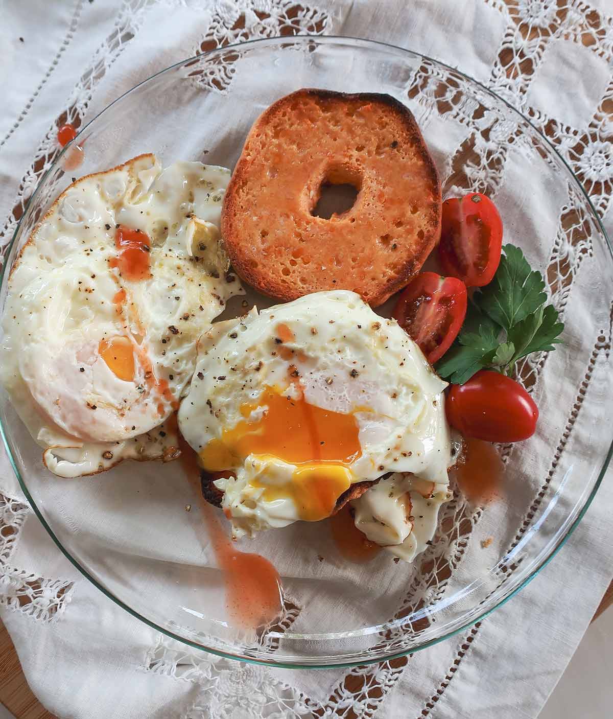 30 minute grain free low carb sliced in half and topped with soft poached egg on a plate with greens