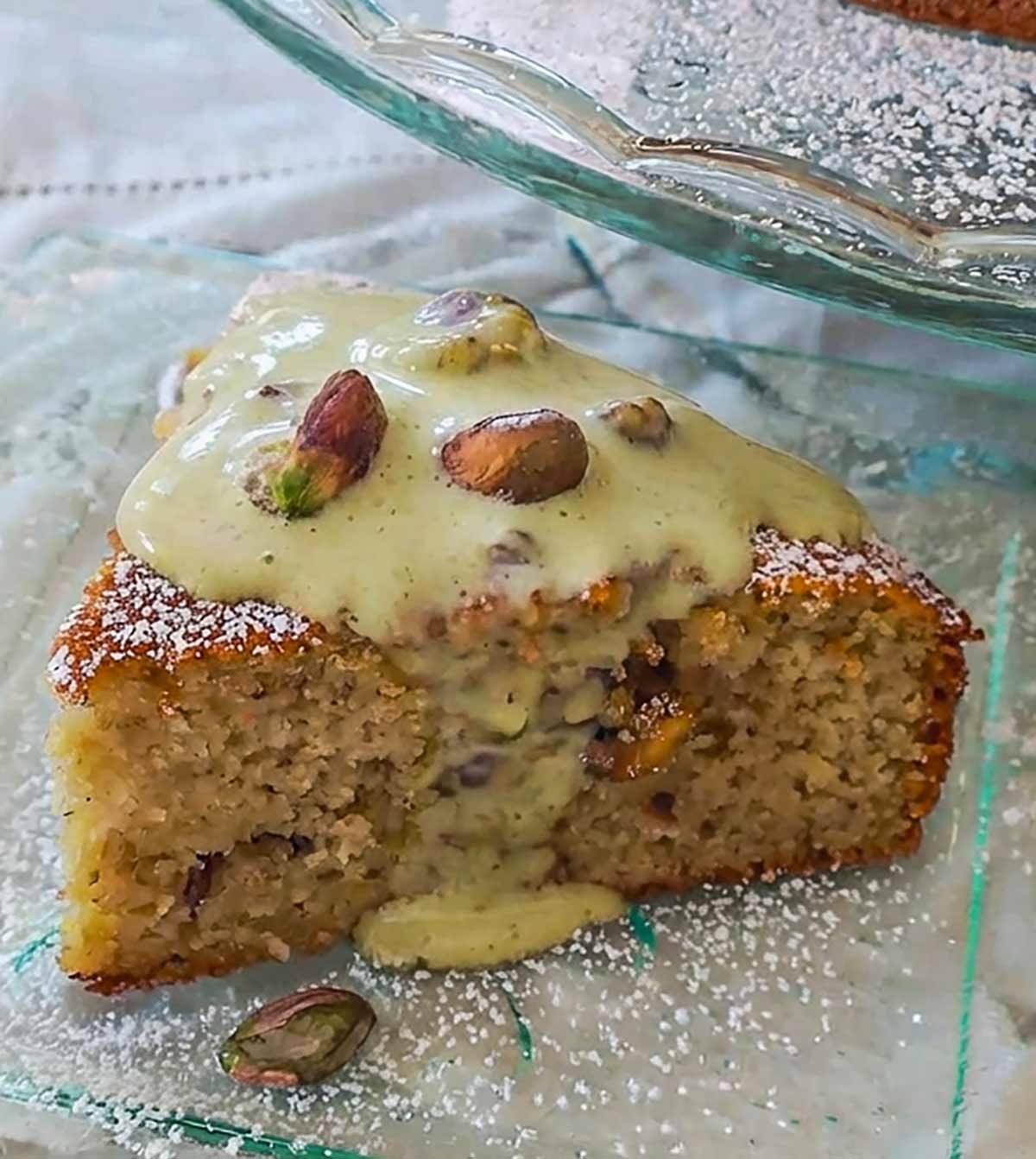 slice of almond flour lemon pistachio cake on a small plate