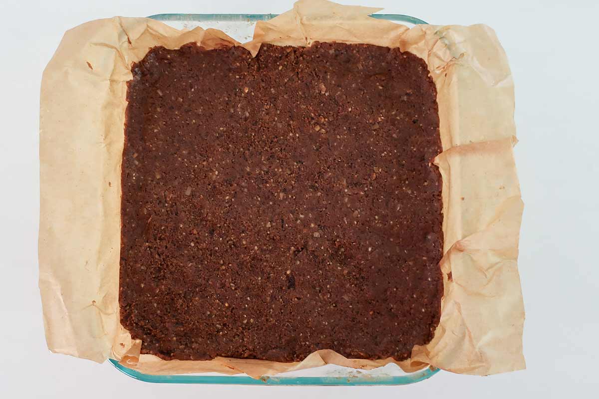 fudgy mixture pressed in an 8x8 inch pan lined with parchment paper