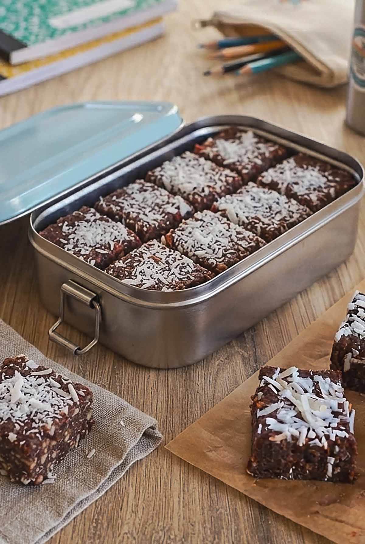Fudgy Chocolate Date Bars packed in a metal lunch box