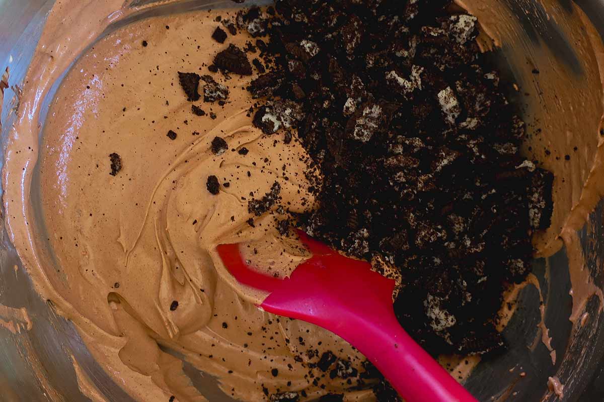 chocolate mousse and chocolate cookie crumbs in a bowl before mixing
