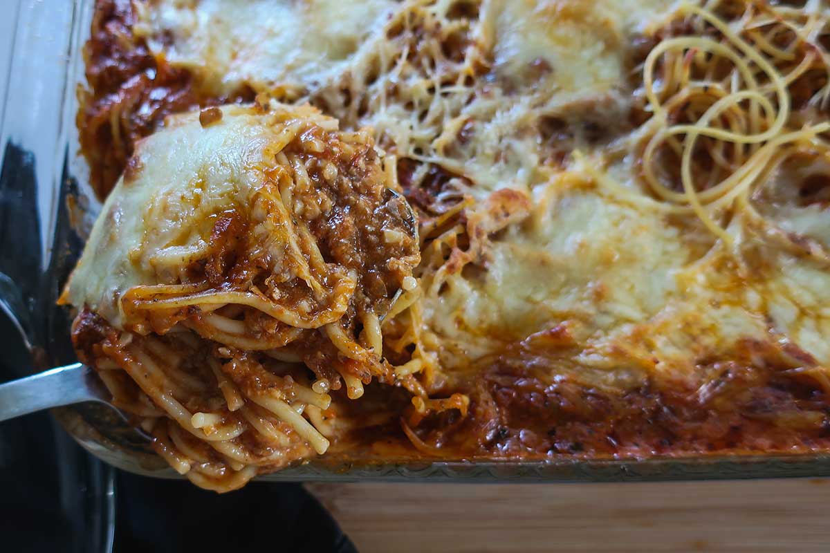 Vegetarian Gluten-Free Million Dollar Spaghetti Bake in a rich creamy mushroom sauce topped with dollops of melted cheese