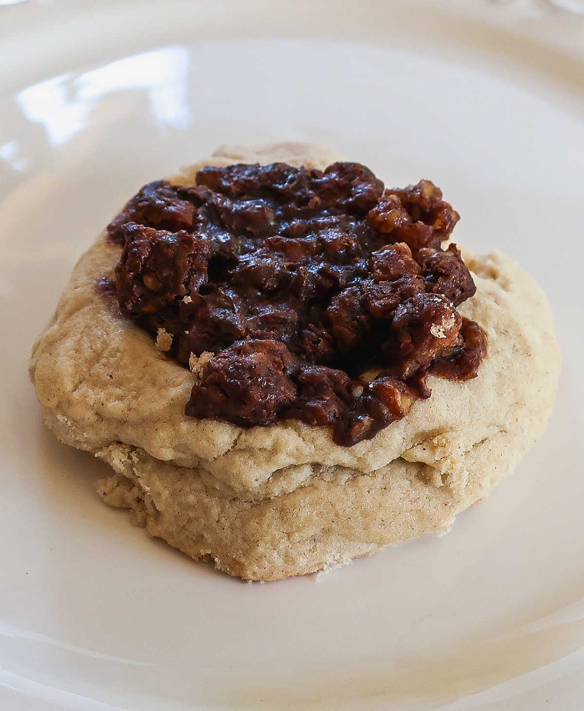 Gluten-Free Maple Pecan Pie Thumbprint Cookie on a small dessert plate