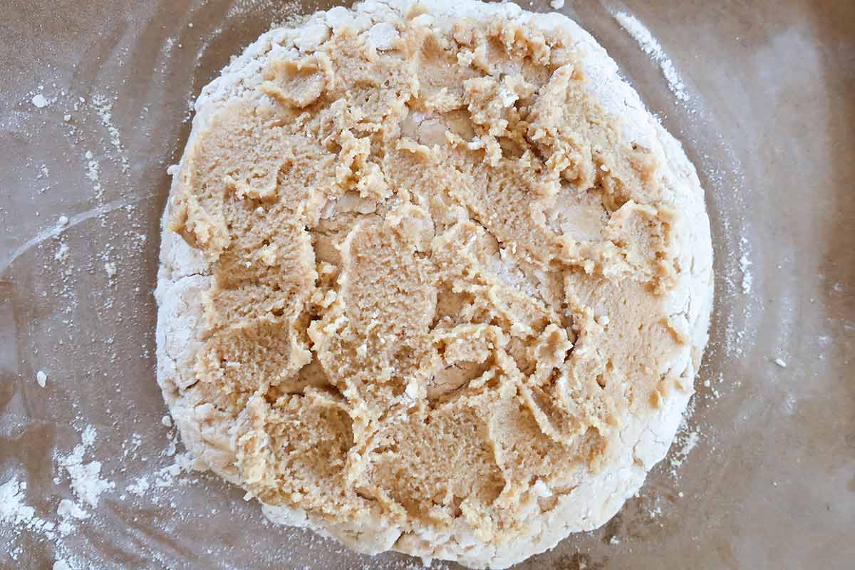 rolled out gluten free dough into a circle and topped with frangipane mixture leaving 1/2 inch room from the edges
