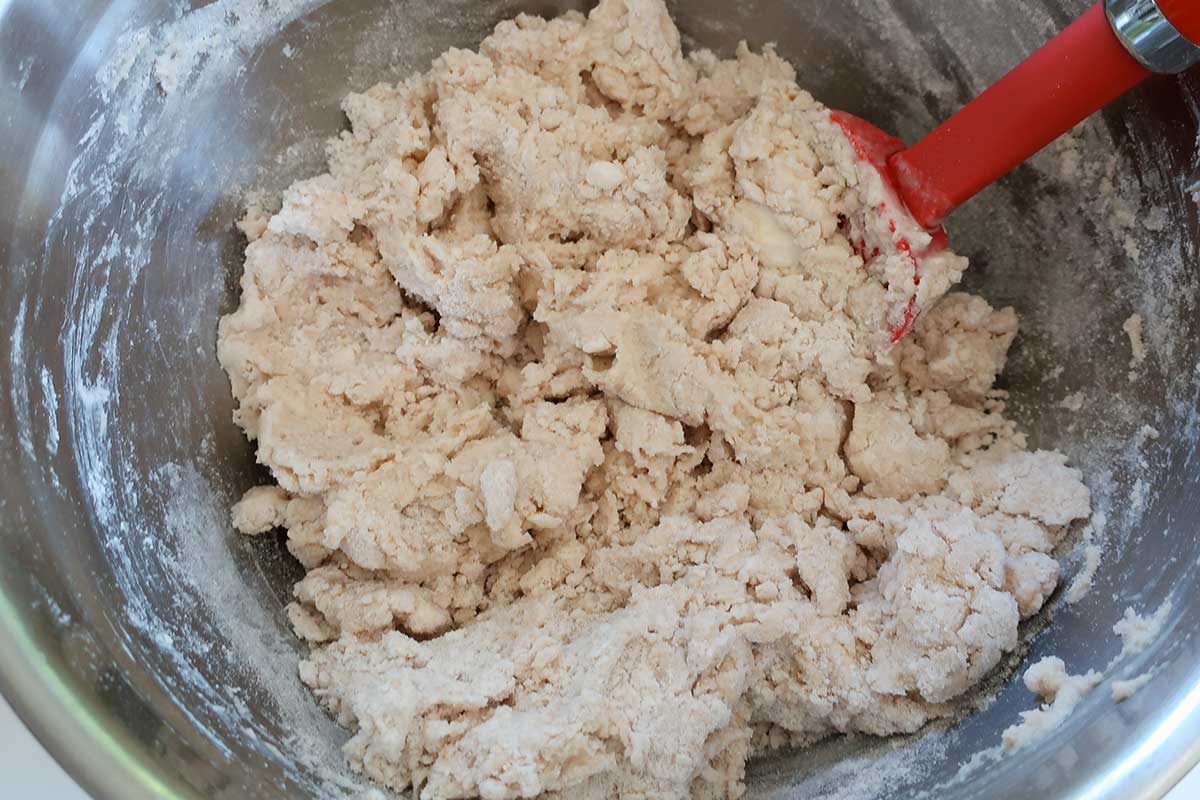 the lightly mixed dough with grated butter for gluten free scones in a bowl