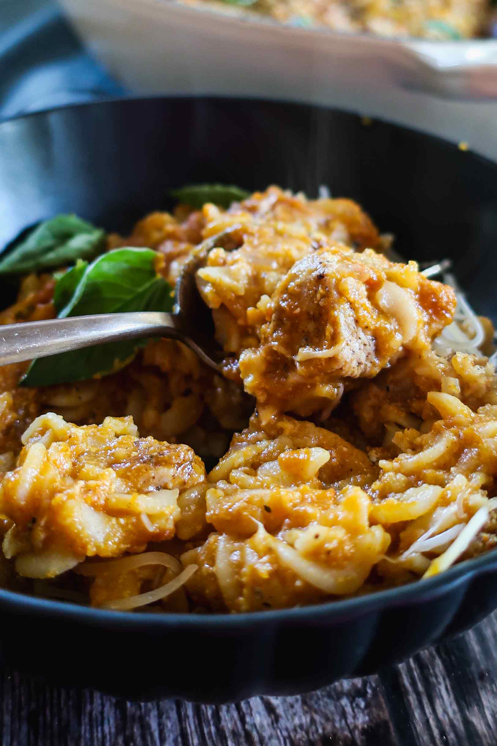 a forkful of Gluten-Free Pumpkin Creamy Chicken Pasta Bake