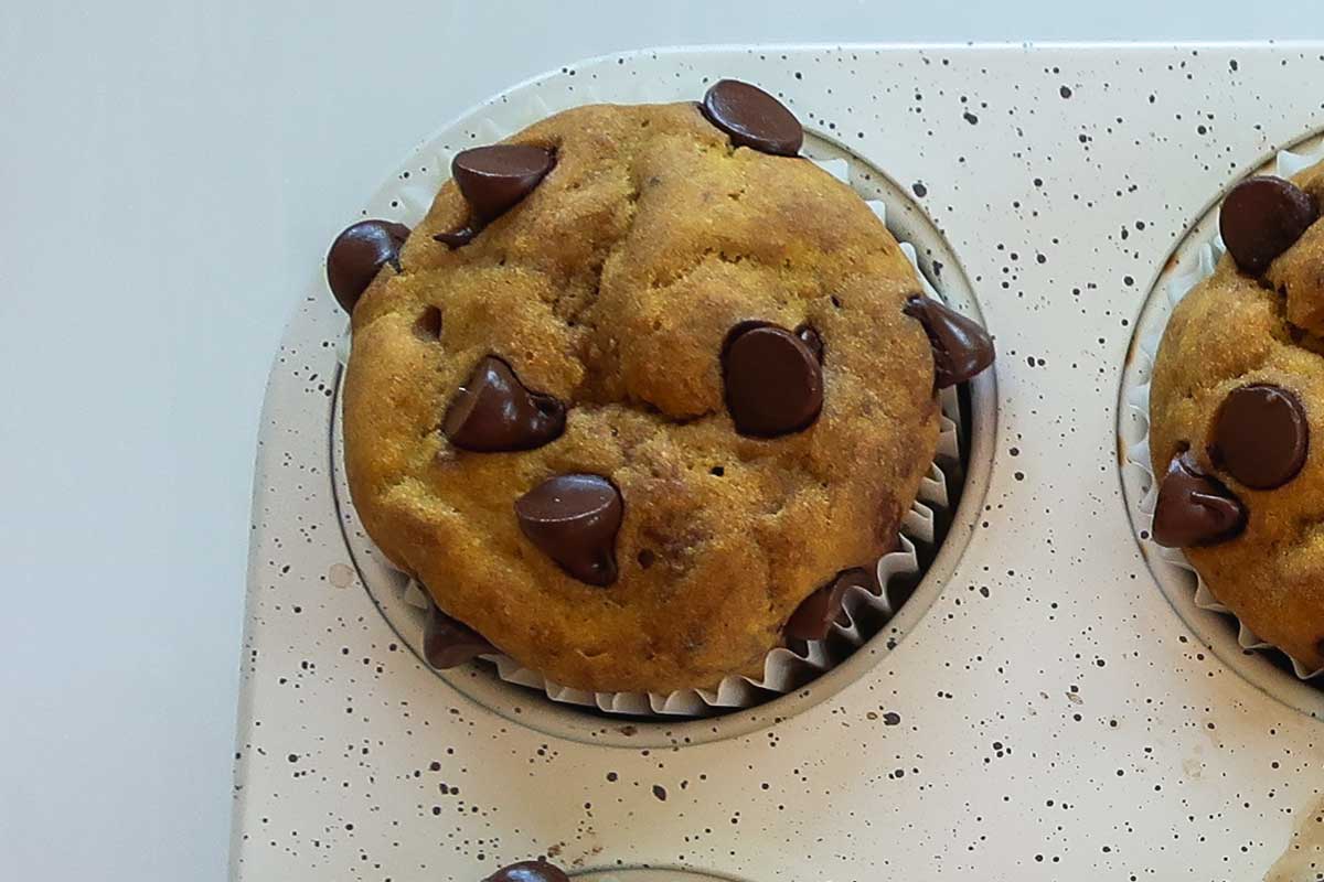 baked Gluten-Free Dairy-Free Banana Pumpkin Muffins with Chocolate in a muffin pan