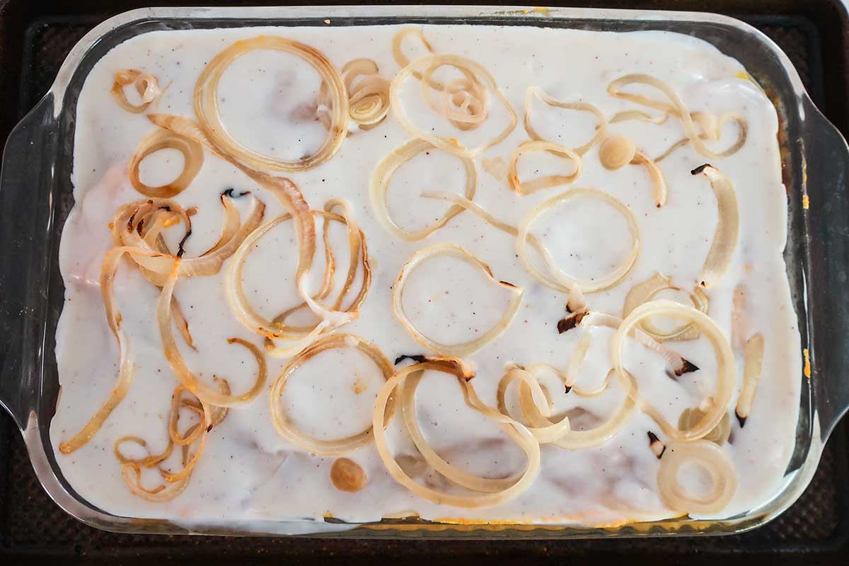 assembled sweet potato lasagna with pumpkin ricotta in a baking dish before baking